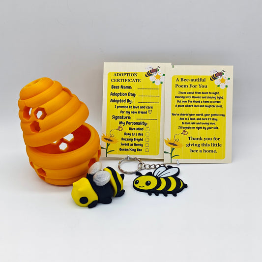 Bee-themed items including a honeycomb-shaped toy, adoption certificate, and keychains on a white background