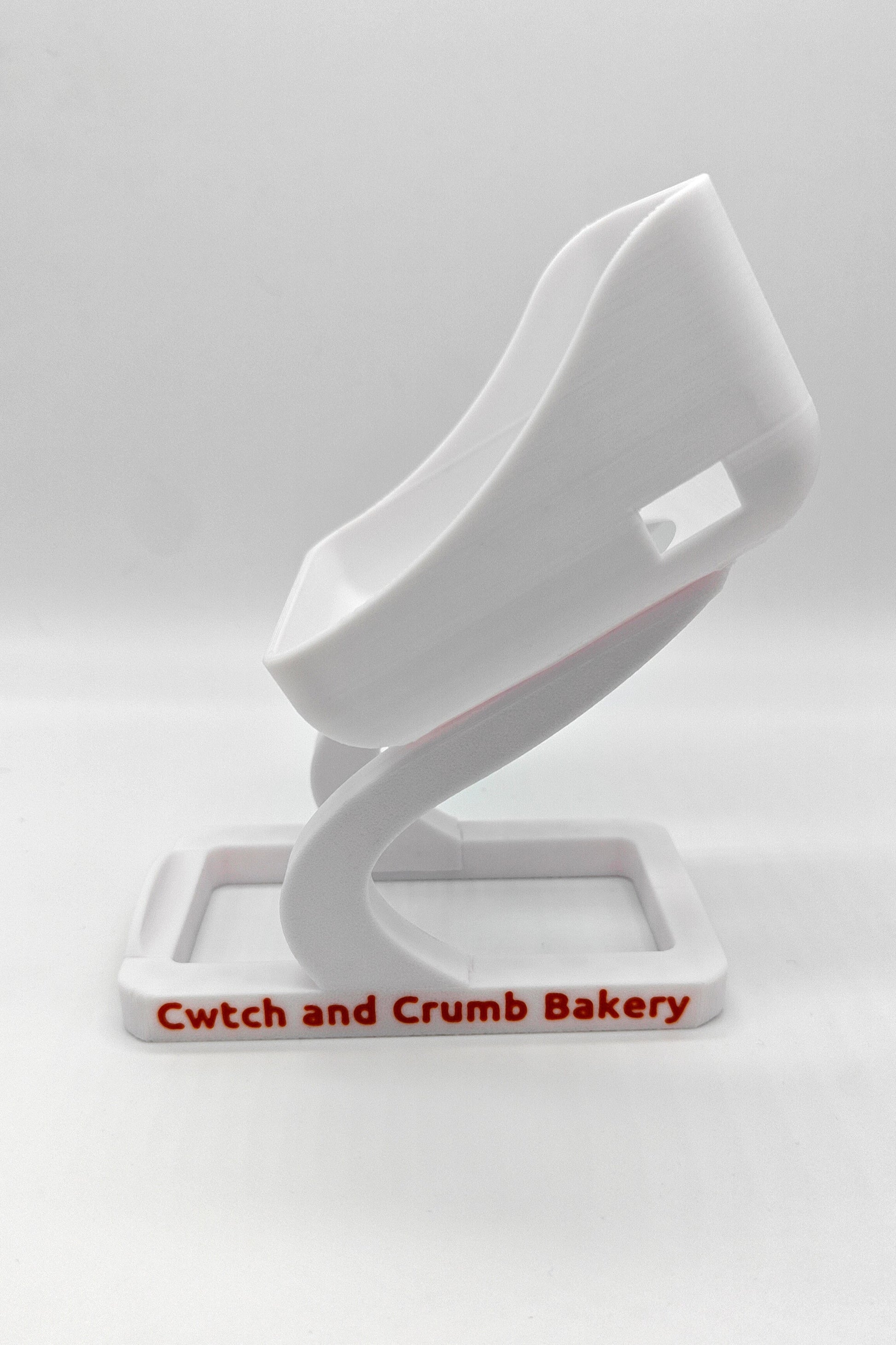 White SumUp stand with 'Cwtch and Crumb Bakery' branding 