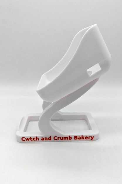White SumUp stand with 'Cwtch and Crumb Bakery' branding 