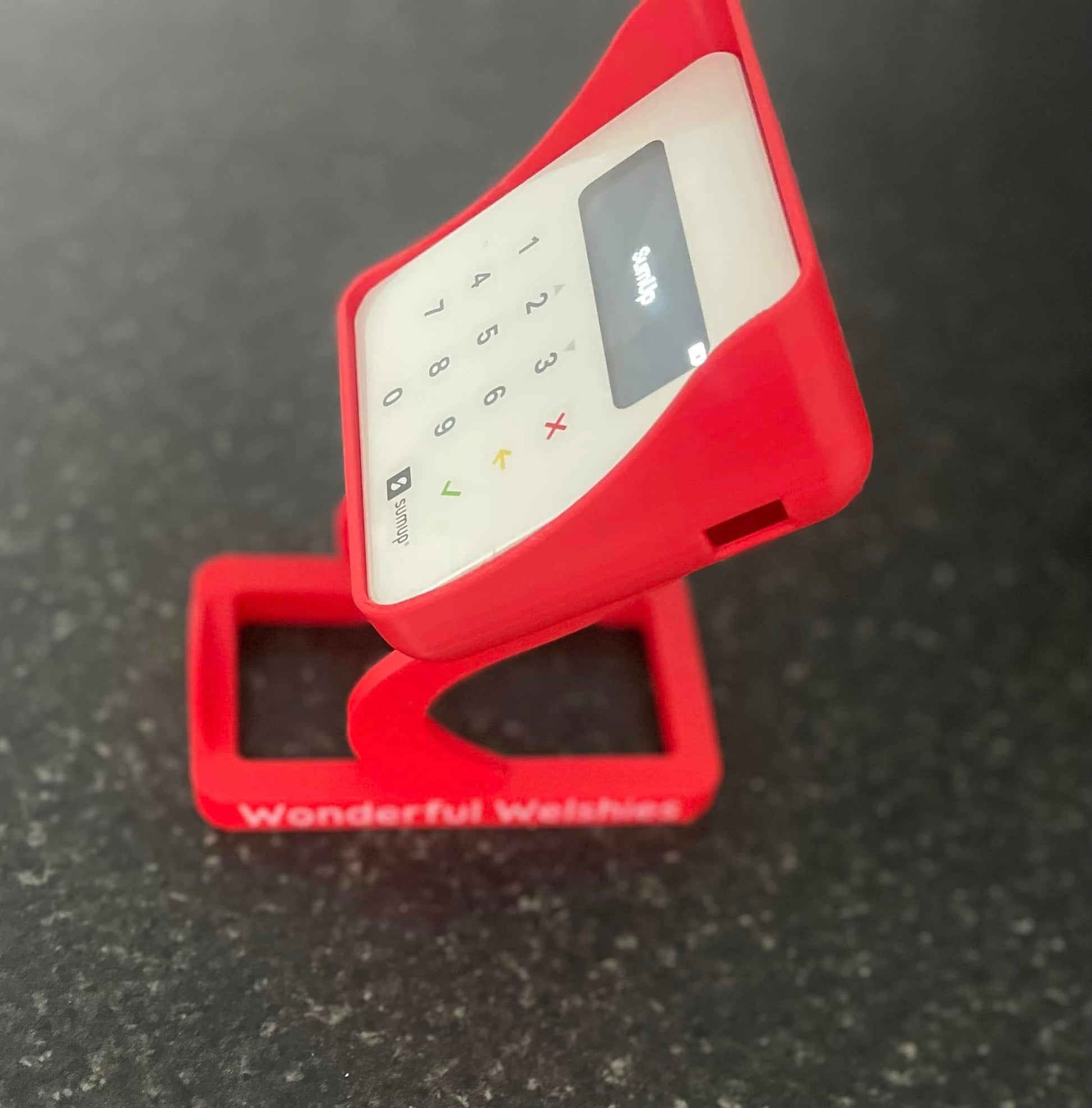 Red SumUp stand printed in red plastic 